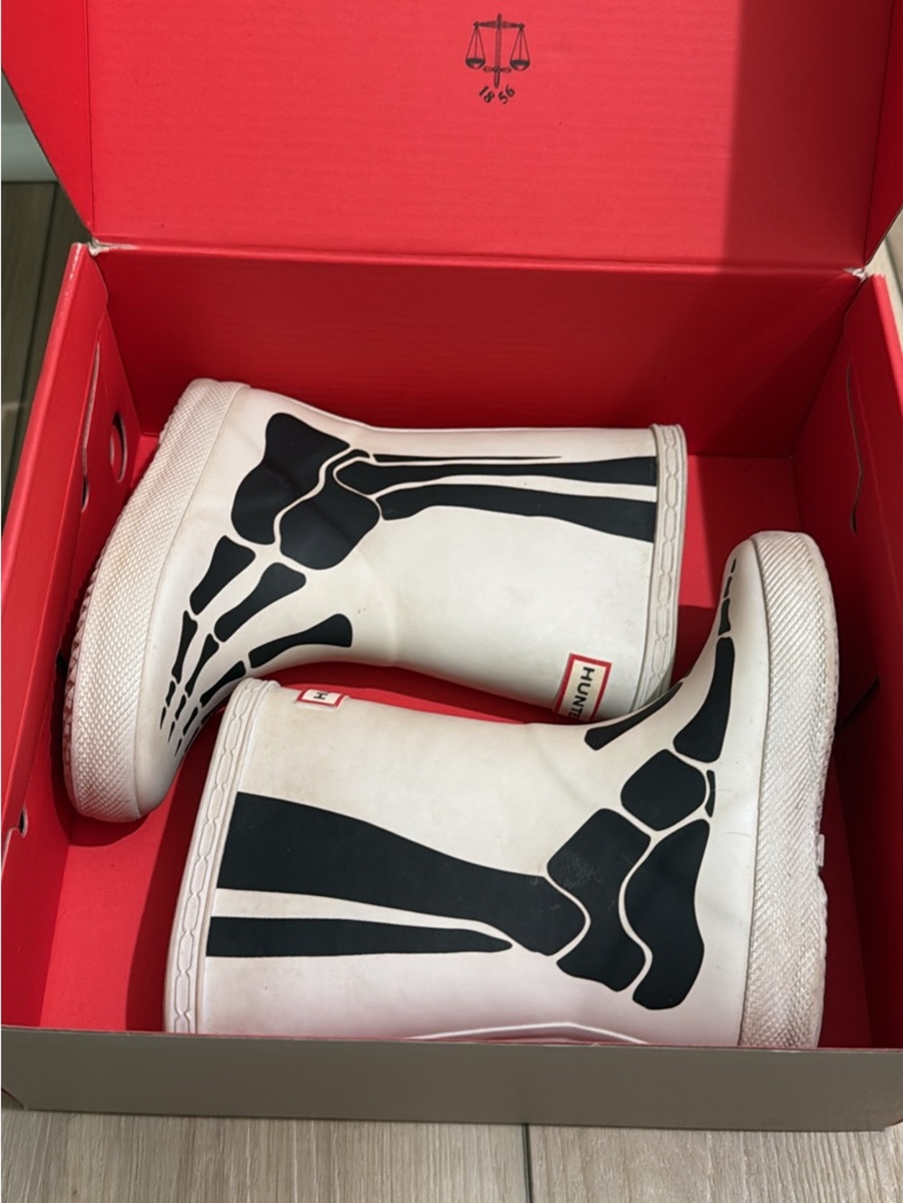 Hunter Kids White Rain Boots with Black Skeleton Print